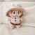 Khaki onesies and hats
