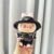 handcuffs striped white shirt + black jeans + vv bag + PPD black hat