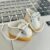 Small white leather shoes