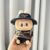 Handcuffs striped brown shirt + black jeans + vv bag + PPD black hat